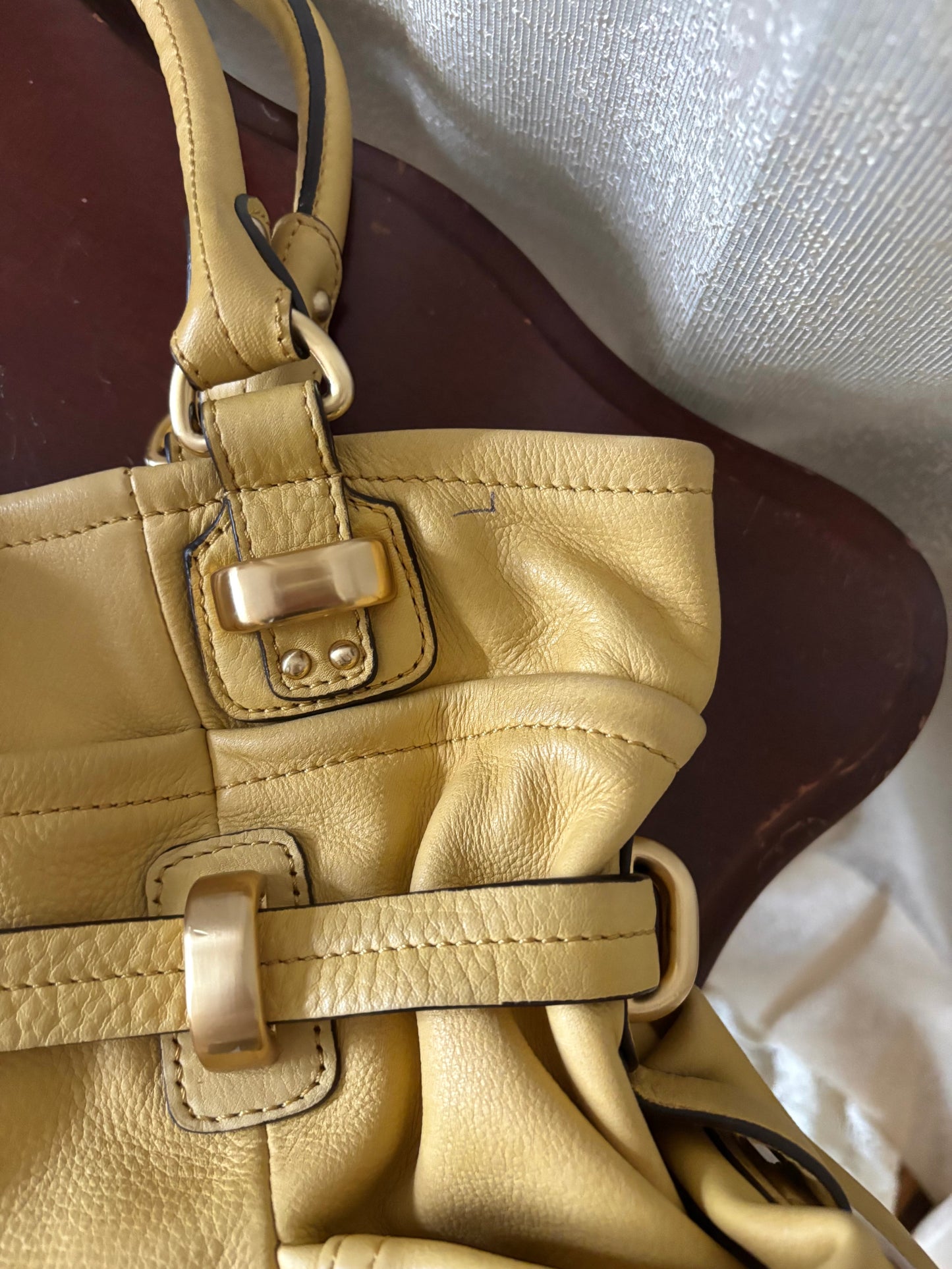 B. Makowsky yellow leather shoulder bag