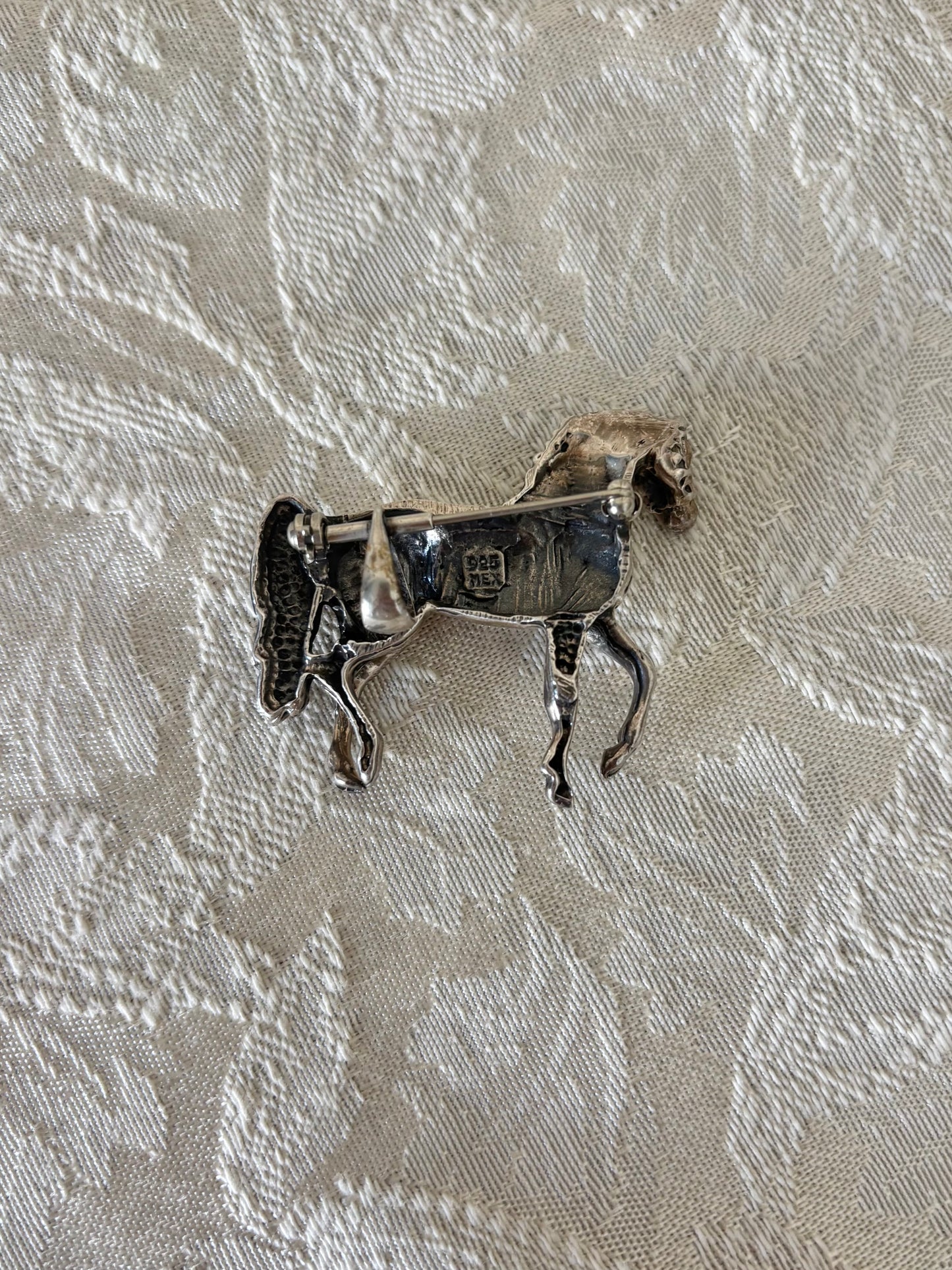 Sterling silver and abalone brooches