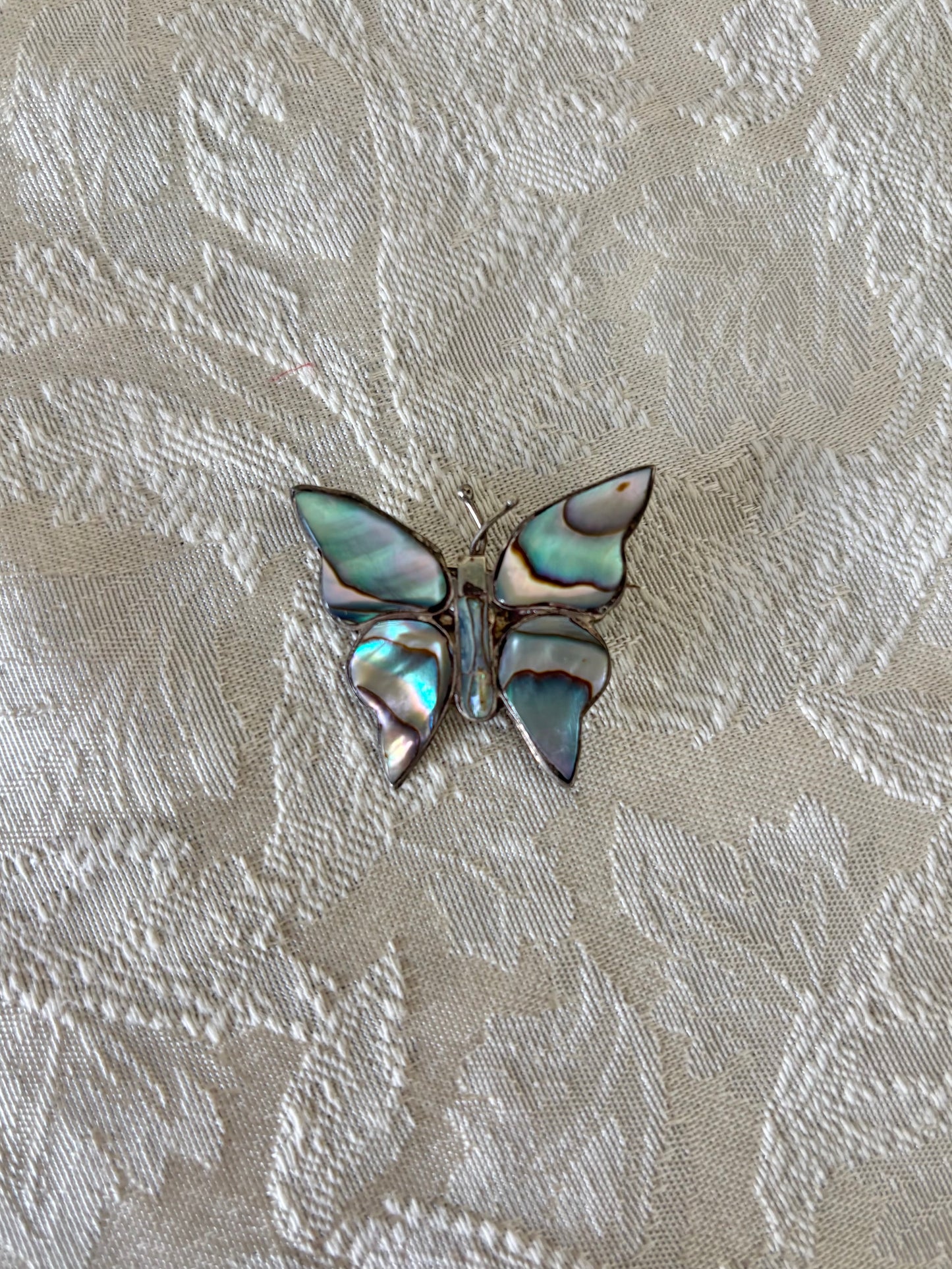 Sterling silver and abalone brooches