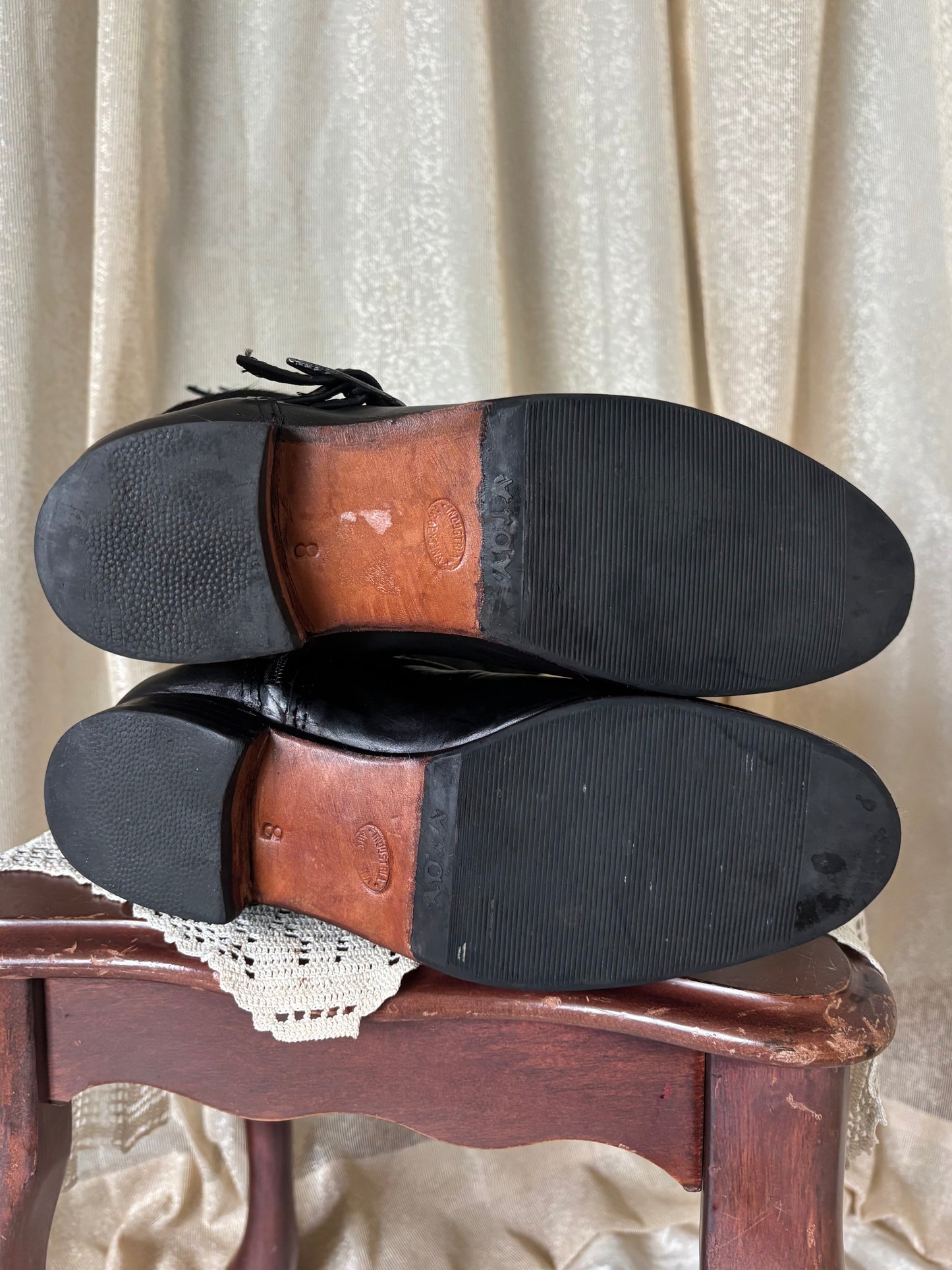Calf hair and leather belt buckle riding boots