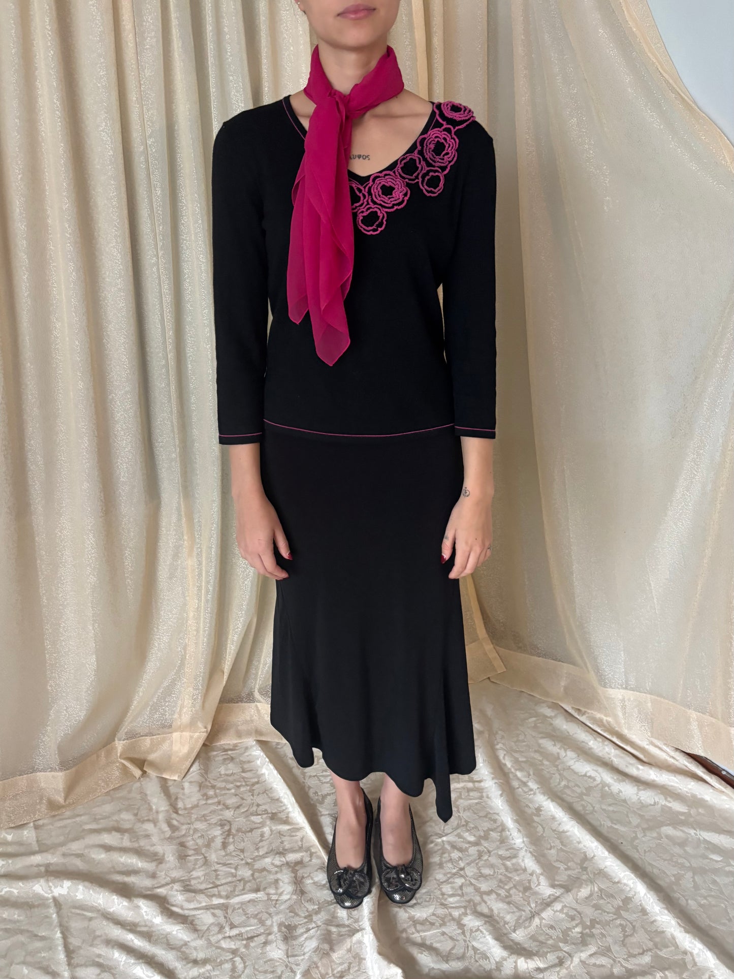 Black asymmetrical midi skirt