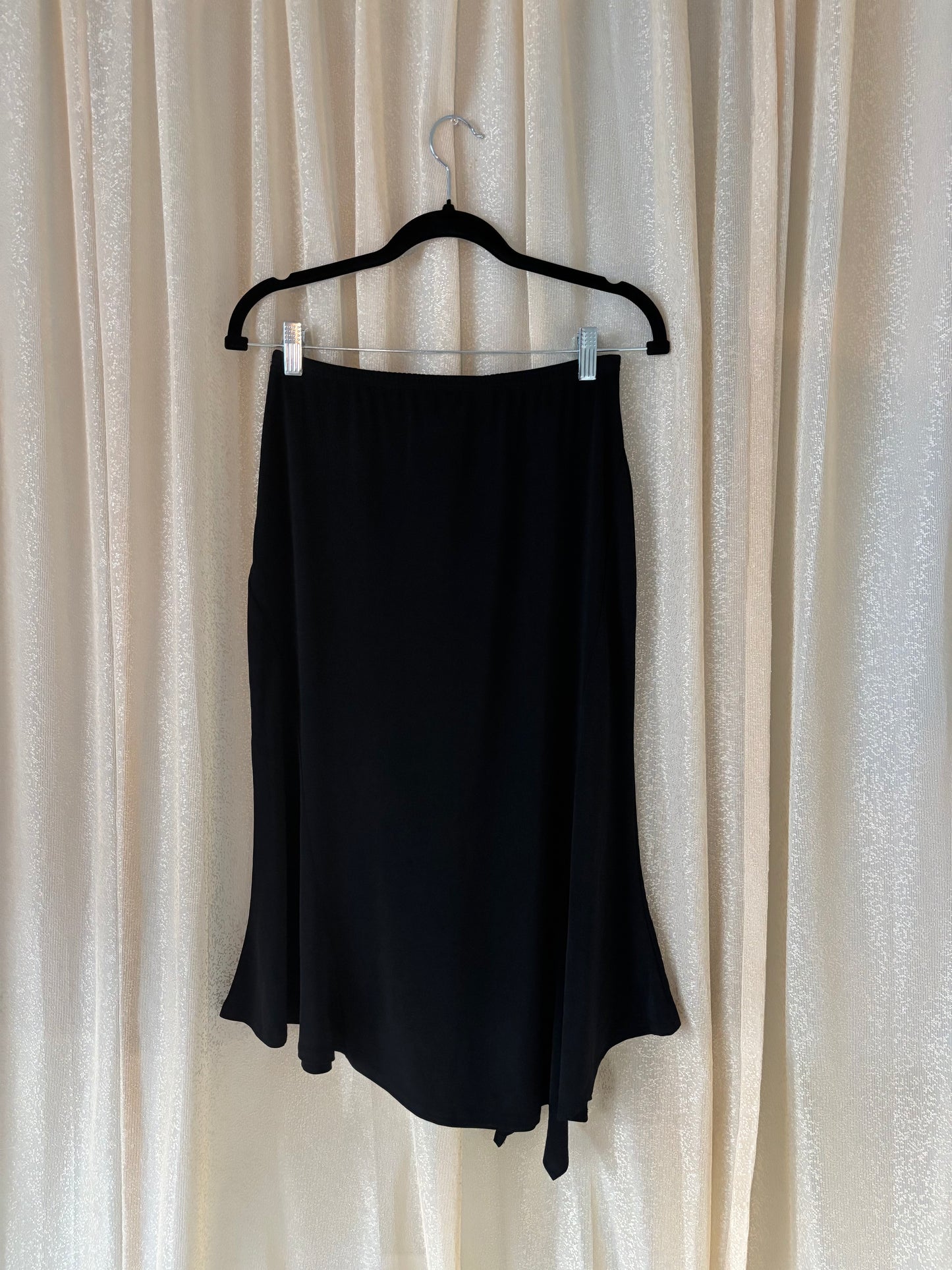 Black asymmetrical midi skirt