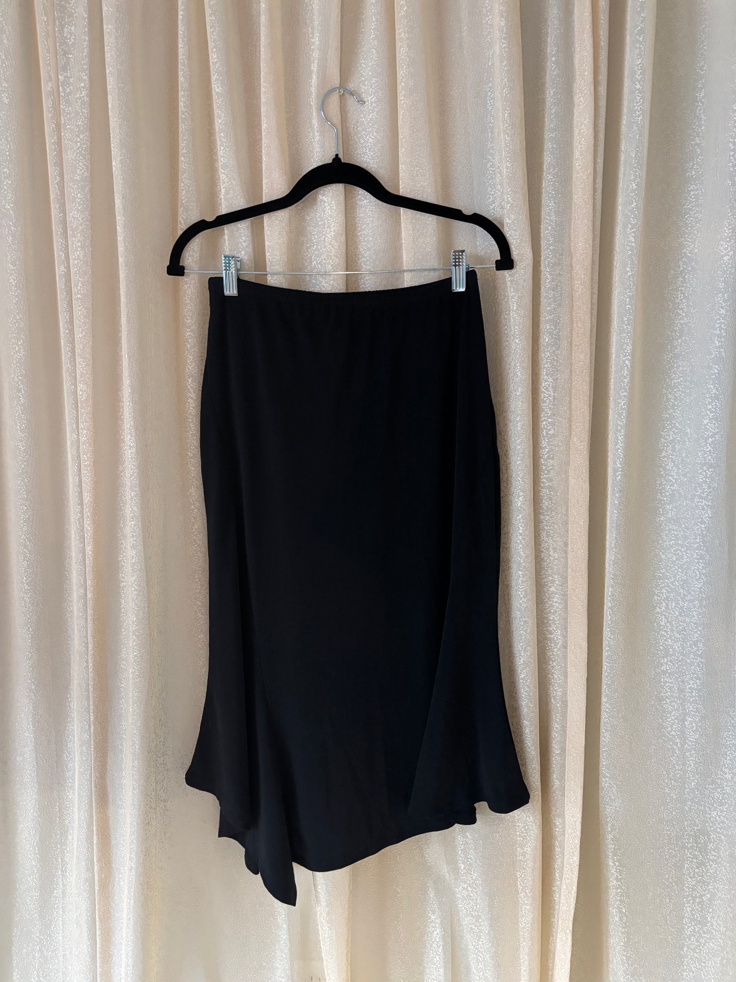 Black asymmetrical midi skirt