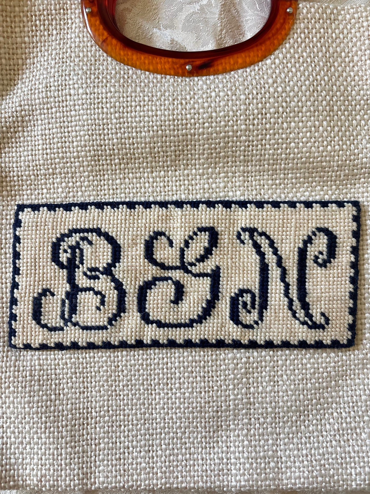 Needlepoint monogram woven bag