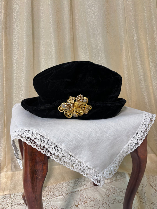 Black velvet hat with brooch