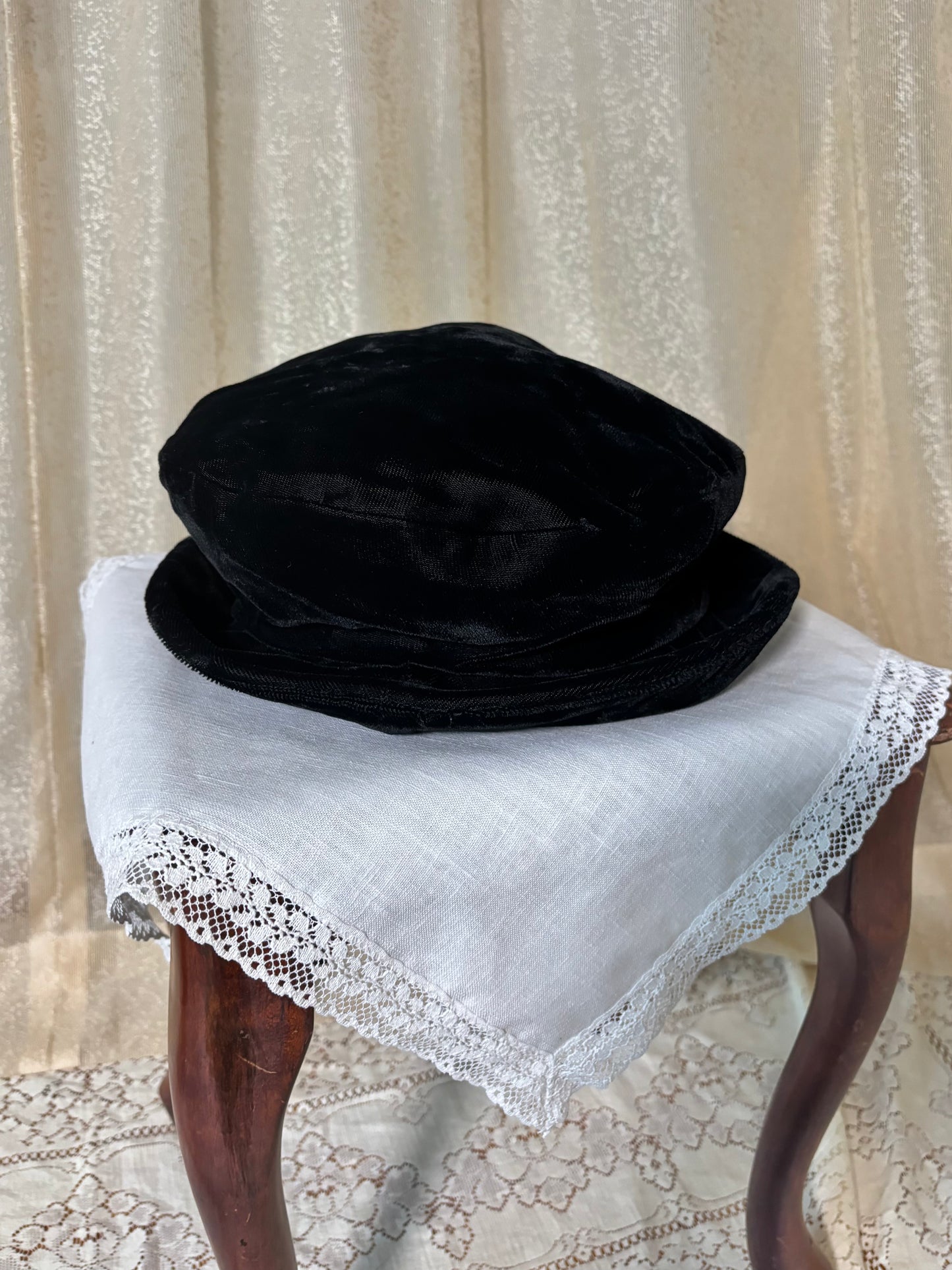 Black velvet hat with brooch