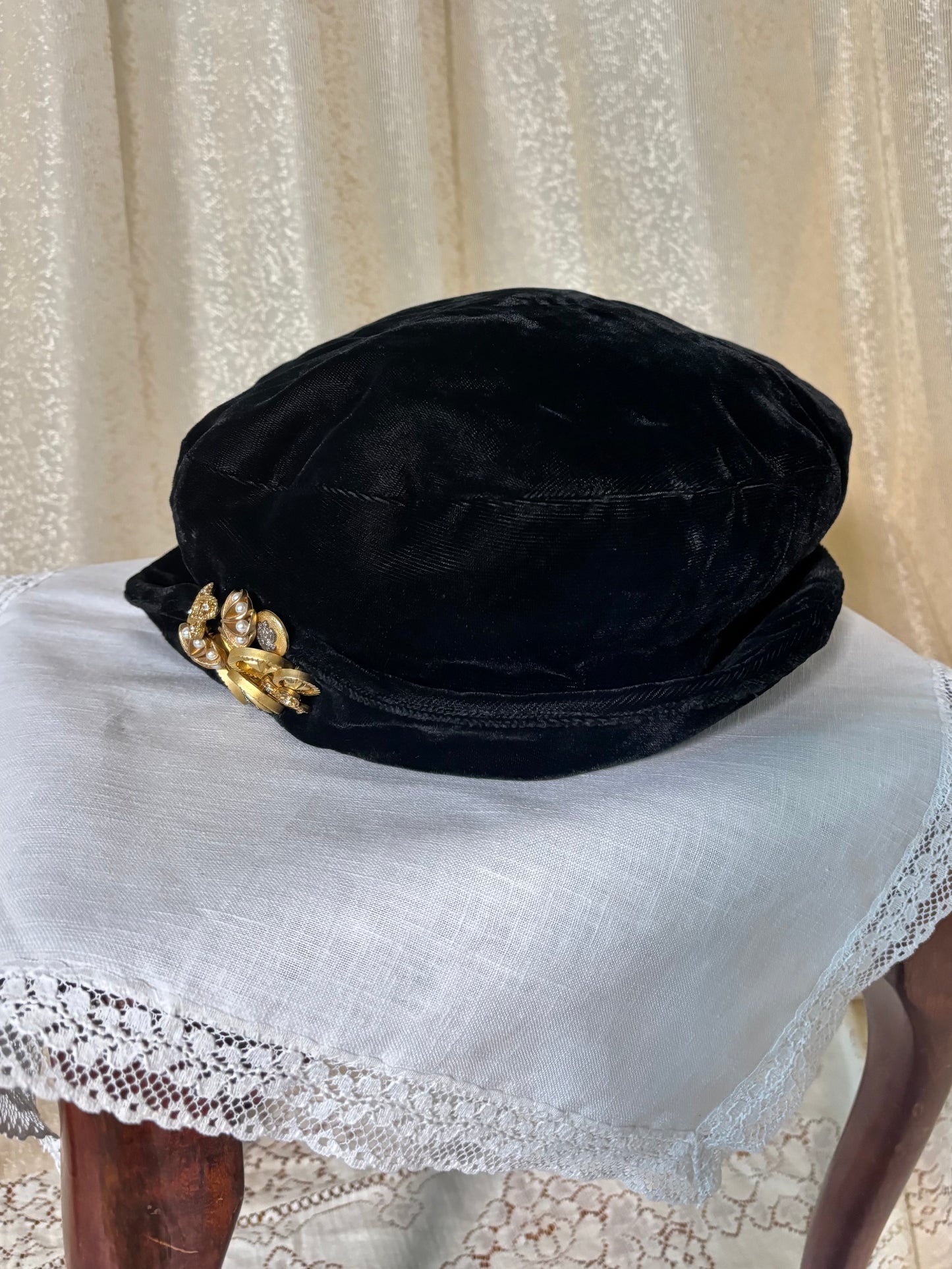 Black velvet hat with brooch