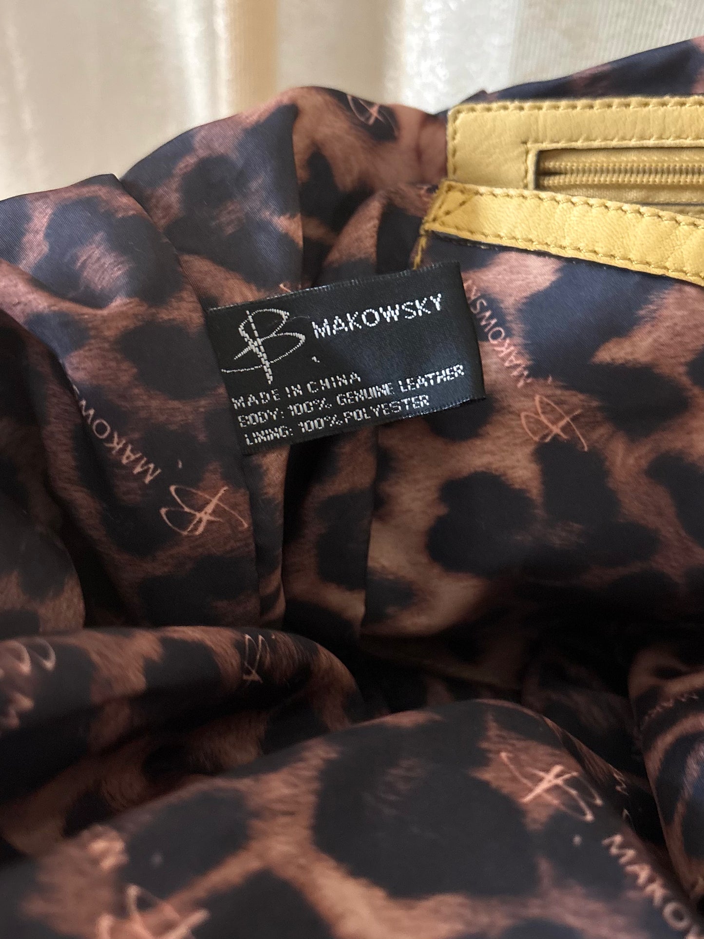 B. Makowsky yellow leather shoulder bag