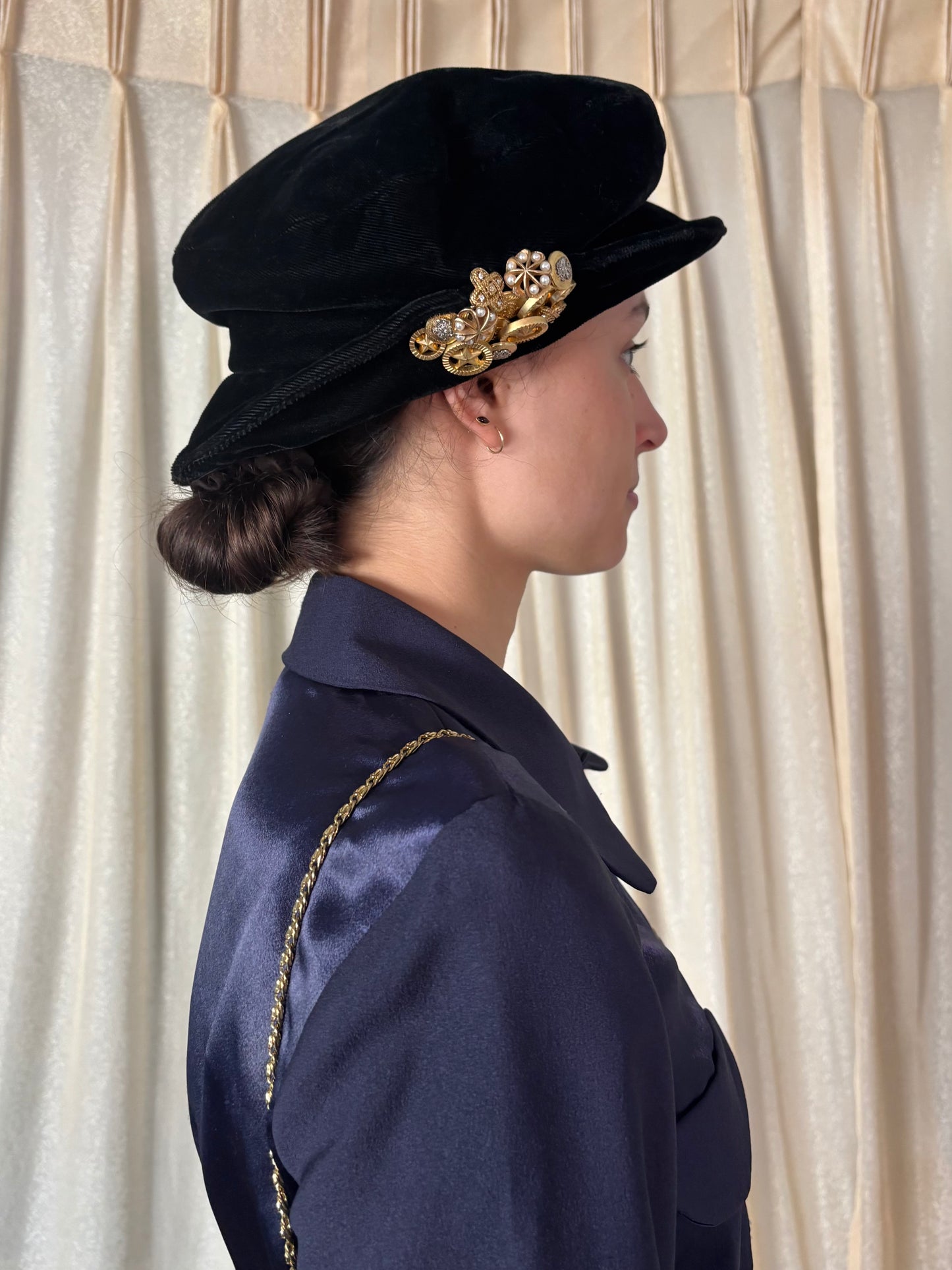Black velvet hat with brooch